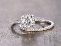 a diamond ring on top of a wooden table