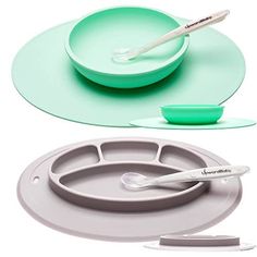 two plates with spoons and toothbrushes sitting on top of each other next to one another