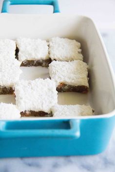 several pieces of cake in a blue and white container