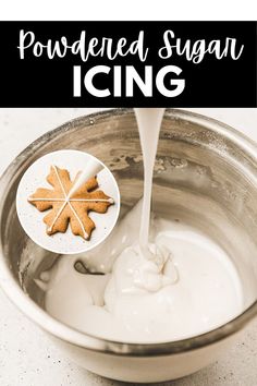 the ingredients for homemade sugar icing are being poured into a metal bowl with an oak leaf on top