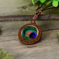 Image Of A Peacock Feather On A Wooden Pendant. Adjustable Cord. New In Package. Comes In A Gold Gift Bag. Purple Pendant Necklace, Green Gemstone Necklace, Green Pendant Necklace, Fish Pendant Necklace, Virgin Mary Necklace, Velvet Choker Necklaces, Clover Jewelry, Native American Necklace, Pearl Statement Necklace