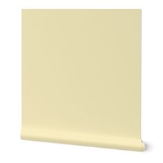 a white wall with a light yellow color on the top and bottom part of it