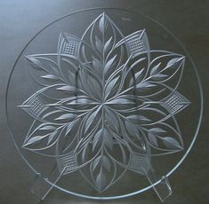 a glass plate with an intricate design on it