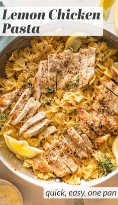 lemon chicken pasta in a skillet with sliced lemons on the side