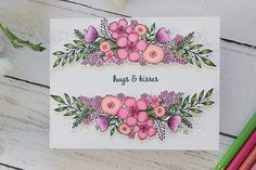 a card with pink flowers and green leaves