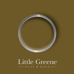 the little greene paint and paper logo on a brown background with a silver ring in the middle