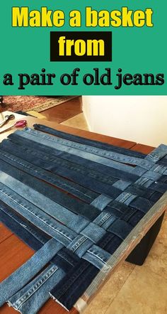 an old pair of jeans sitting on top of a wooden table with text overlay that reads make a basket from a pair of old jeans