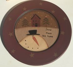 a plate with a snowman on it that says snow place like home