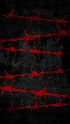 red barbed wire on black background with dark grungy textured area in the foreground