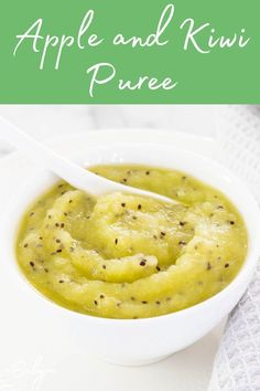 an apple and kiwi puree in a white bowl with a spoon on the side