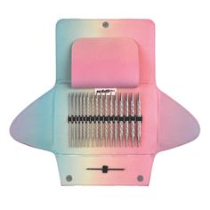 a pink and blue case with two combs in it on top of a white background