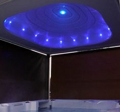 the inside of a hot tub with blue lights