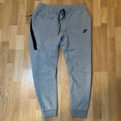 Brand New Without Tags! My Brother Bought These Online But Theyre Too Small On Him So He Never Got To Wear Them. Retailed: $110. Tapered Style. Gray Fleece Athleisure Pants, Gray Fleece Joggers For Winter, Sporty Gray Joggers For Winter, Gray Athleisure Sweats With Side Pockets, Winter Athleisure Gray Joggers, Gray Fleece Sweats For Jogging, Gray Sporty Joggers For Fall, Sporty Gray Joggers For Fall, Casual Gray Nike Joggers