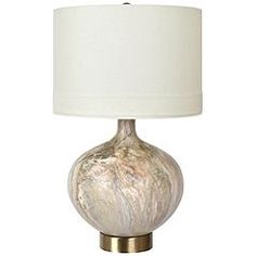 a table lamp with a white shade on it