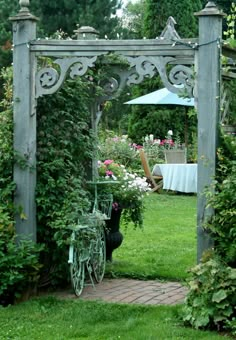 an outdoor garden area with flowers and plants