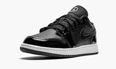 The Air Jordan 1 Low SE GS “All-Star 2021” is a special NBA All-Star Weekend 2021 colorway of Michael Jordan’s first signature shoe in youth sizing.  Along with the Jordan 1 Mid of the same nickname, the “All-Star 2021” is a February 2021 release that dresses the beloved Jordan 1 Low in a sleek black-and-white colorway for endless wearability.  Glossy black patent leather panels on the forefoot, eyelets, collar, and heel attract attention while retaining a casual appearance.  Jordan Brand contin Black Jordans Low, Black Low-top Jordan Shoes, Black Low-top Jordan Shoes With Perforations, Air Jordans 1 Low Black, Luxury Black Low-top Jordan Shoes, Air Jordan Low, Jordan Low, Jordan 1 Low, Air Jordan 1 Low