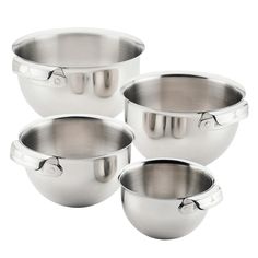 four stainless steel mixing bowls with handles on each side and one bowl in the middle