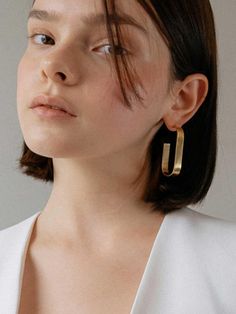 * Made to order item.(non-refundable)- Simple design- Bold thickness ring- Ring earringMeasurement- 2 x 0.3"- Weight: 0.3 ozComposition & Care- Silver925- 14K gold platingDesigner- Imported- by MCCOII- Style#: 300504112 Elegant Single Oblong Earring, Elegant Tarnish Resistant Oblong Earrings, Elegant Oblong Earrings For Pierced Ears, Elegant Oblong Earrings, Minimalist Oblong Earrings For Formal Occasions, Modern Oblong Single Earring Jewelry, Modern Tarnish Resistant Oblong Jewelry, Modern Formal Earrings With Bezel Setting, Modern Oblong Jewelry For Anniversary