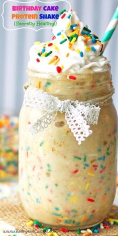 birthday cake protein shake in a mason jar with sprinkles and a straw