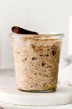 a glass jar filled with oatmeal and cinnamon