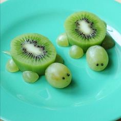 two pieces of kiwi fruit on a blue plate