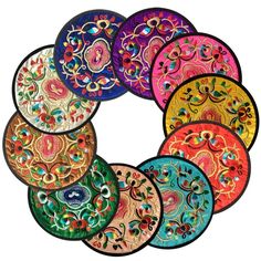 six colorful plates are arranged in the shape of a circle on top of each other