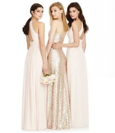 three women in long dresses standing next to each other and one is wearing a dress with sequins on it