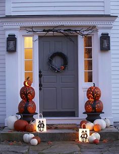 halloween decorations on the front steps of a house