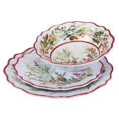 three white dishes with red trimmings and floral designs on them, all stacked together