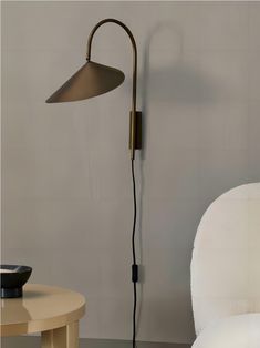 a lamp that is next to a chair