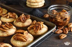 some pecans and cookies are on a tray