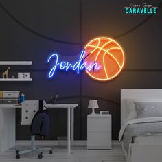 a neon sign that says jordan above a basketball ball on a wall in a bedroom