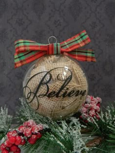 a christmas ornament with the word believe on it