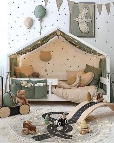 a child's bedroom decorated in neutral colors with teddy bears and toys on the floor