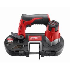 the milwaukee power tool is shown with two tools on it's side and one in its