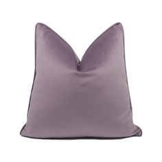 a purple pillow on a white background