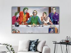 a group of clowns sitting at a table with the last supper in front of them