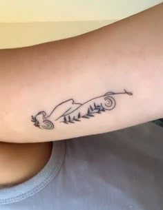 a woman's arm with a tattoo on it