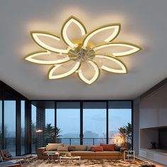 a living room with a large flower shaped light fixture