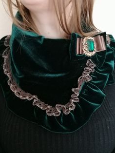 Up-cycled vintage velvet, soft and unique wrap scarf for a sophisticated yet creative look.  Detailing includes velvet frills, lace and separate brooch with emerald green cabochon. Has a slick lining  keep you comfortable and every day you can create your own design with the attached brooch. Measurements: Length-28 inches (71 cm) Width- 8 inches (20 cm) Thank you so much for visiting my shop! Elizabethan Collar, Recycled Necklaces, Velvet Scarf, Bow Brooch, Lace Wrap, Fabric Necklace, Necklace Display, Green Bows, Wrap Scarf