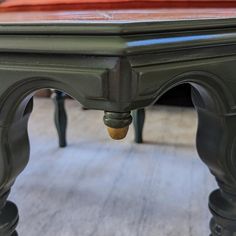 a close up of a table with a red cloth on it's back end