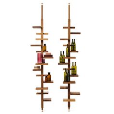 two tall wooden shelves with bottles on them