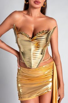 Elevate Your Wardrobe with the Selene Gold Corset Metallic 2 Piece Set! This stunning set features a beautifully designed corset top with intricate metallic detailing that hugs your curves perfectly. The shimmering fabric not only catches the light but also enhances your natural allure, making you the center of attention wherever you go. Whether you're heading to a glamorous evening event, a night out with friends, or a special dinner date, the Selene Gold Corset Set is the perfect choice to sho Glamorous Overbust Corset Dress, Party Underbust Corset Belt With Boned Bodice, Glamorous Overbust Corset For Parties, Sleeveless Boned Bodice Corset For Party Season, Glamorous Corset With Corset Back For Party Season, Strapless Satin Corset Belt For Parties, Sleeveless Party Corset With Corset Back, Glamorous Sleeveless Corset With Boned Bodice, Glamorous Overbust Corset For Evening