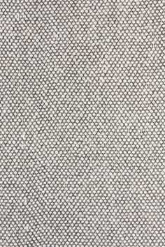 an up close view of a white and black textured fabric background or wallpaper