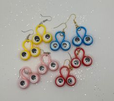 "Feeling Nostalgic? Googly Eye Toy Earrings! Made from mini googly eye ring toys with gold or silver split rings and gold or silver fish hook findings.  Available in red, yellow, light pink and blue! Earrings measure 2\" inch in drop length by about a 1 1/4\" inch in width." Toy Earrings, Bead Creations, Feeling Nostalgic, Silver Fish, Googly Eyes, Split Rings, Yellow Light, Eye Ring, Blue Earrings