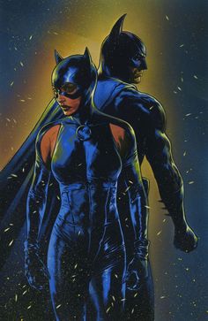 the batman and catwoman are standing next to each other