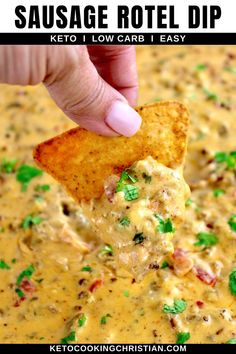 a tortilla chip being dipped with cheese and cilantro