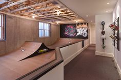 a skateboard ramp in the middle of a room