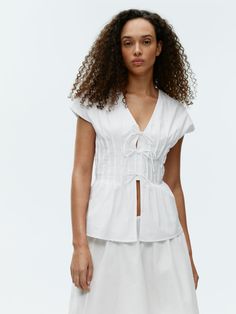 Pleated top crafted from cotton. A slim-fitted style with tie straps at the front. Style With Tie, Scarf Bib, Adidas Bags, Spring Suit, Pleated Top, Pleat Top, Top Crafts, Fitted Style, Popular Outfits