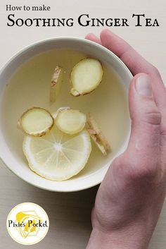 a person holding a bowl of water with lemon slices in it and the words health benefits of drinking warm water with lemon every morning